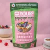 Hier ist ein Produktbild des nährstoffoptimierten Granolas von Nutripur mit Müslischale und fruchtschale im Hintergrund.