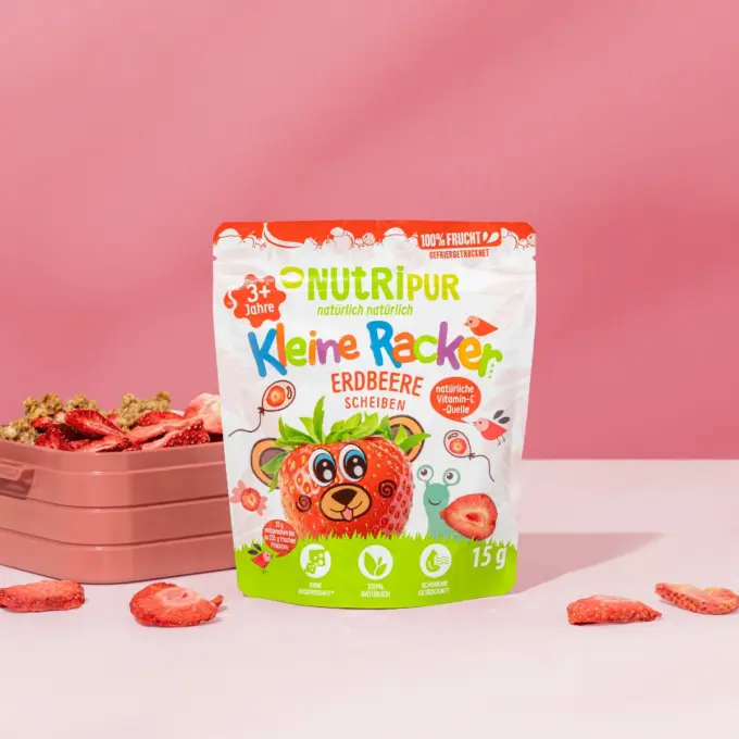 Bild zeigt die kleinen Racker der Sorte Erdbeere von Nutripur mit Verpackung und Brotdose