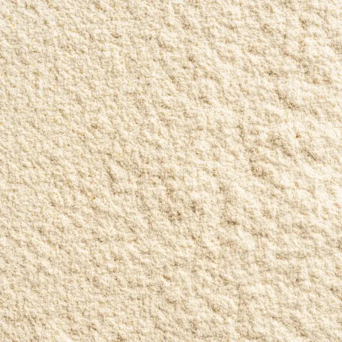 Ein Bild zeigt eine Makroaufnahme des Super Isolat Whey Proteinpulvers Zimt von NutriPur