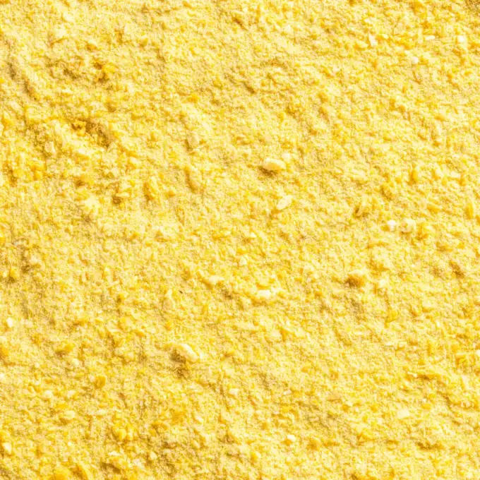 Ein Bild zeigt eine Makroaufnahme des gefriergetrockneten Mango-Fruchtpulvers von Nutripur